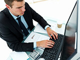 Business man working at desktop computer